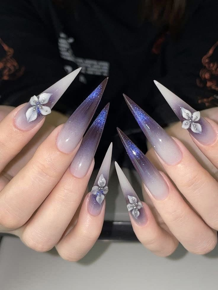Custom purple ombre stiletto nails with 3D floral art crafted