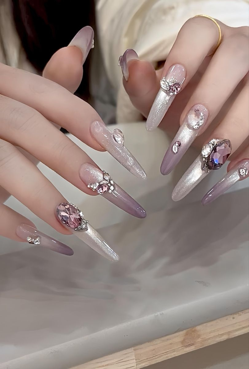 Smokey blue and black stiletto nails with liquid chrome silver 3D metal art