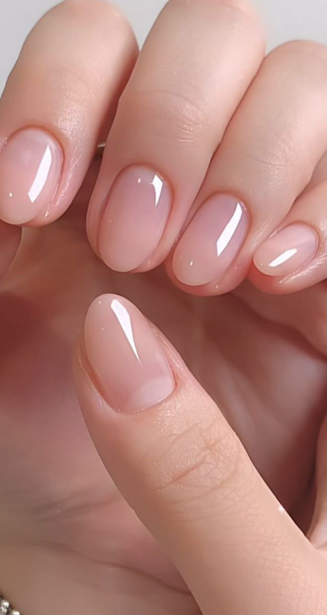 Short oval sheer nude pink poly gel overlay manicure with mirror gloss