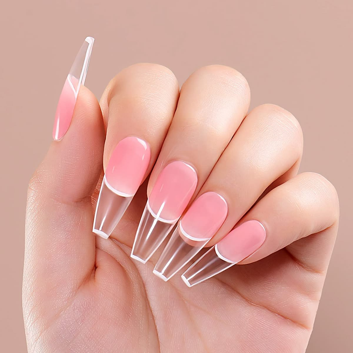Long coffin pink nail extensions with clear glass tips and white French line